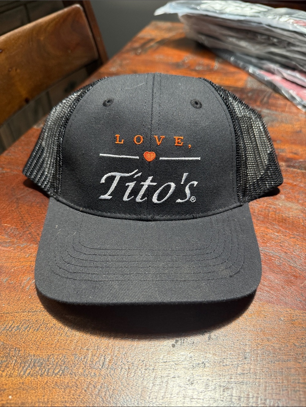 Tito's Black Trucker Hat with Orange Accent